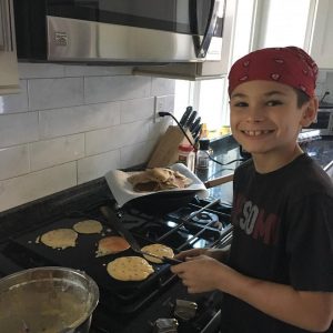 Jennifer Robins - son making pancakes